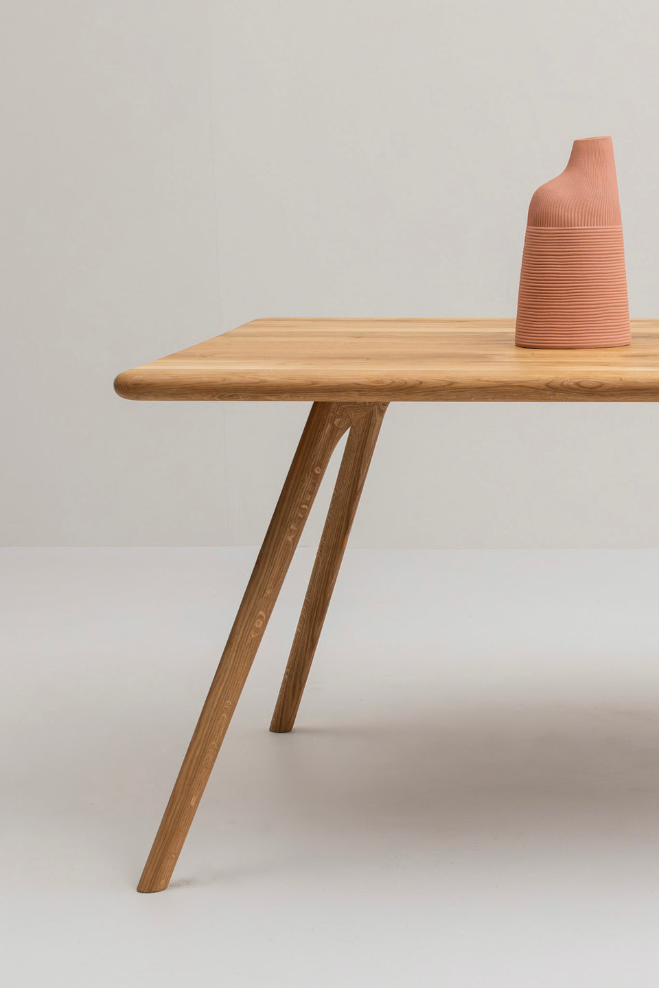 Refined rectangular silhouette with softened corners.