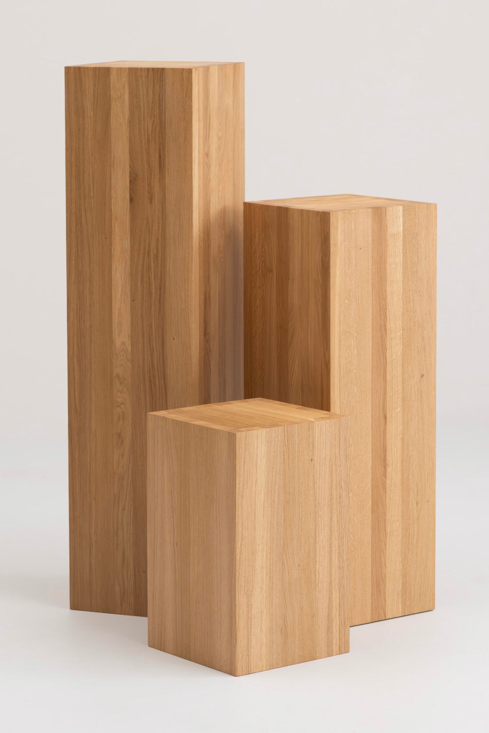 Available in three heights for layered, sculptural arrangements.