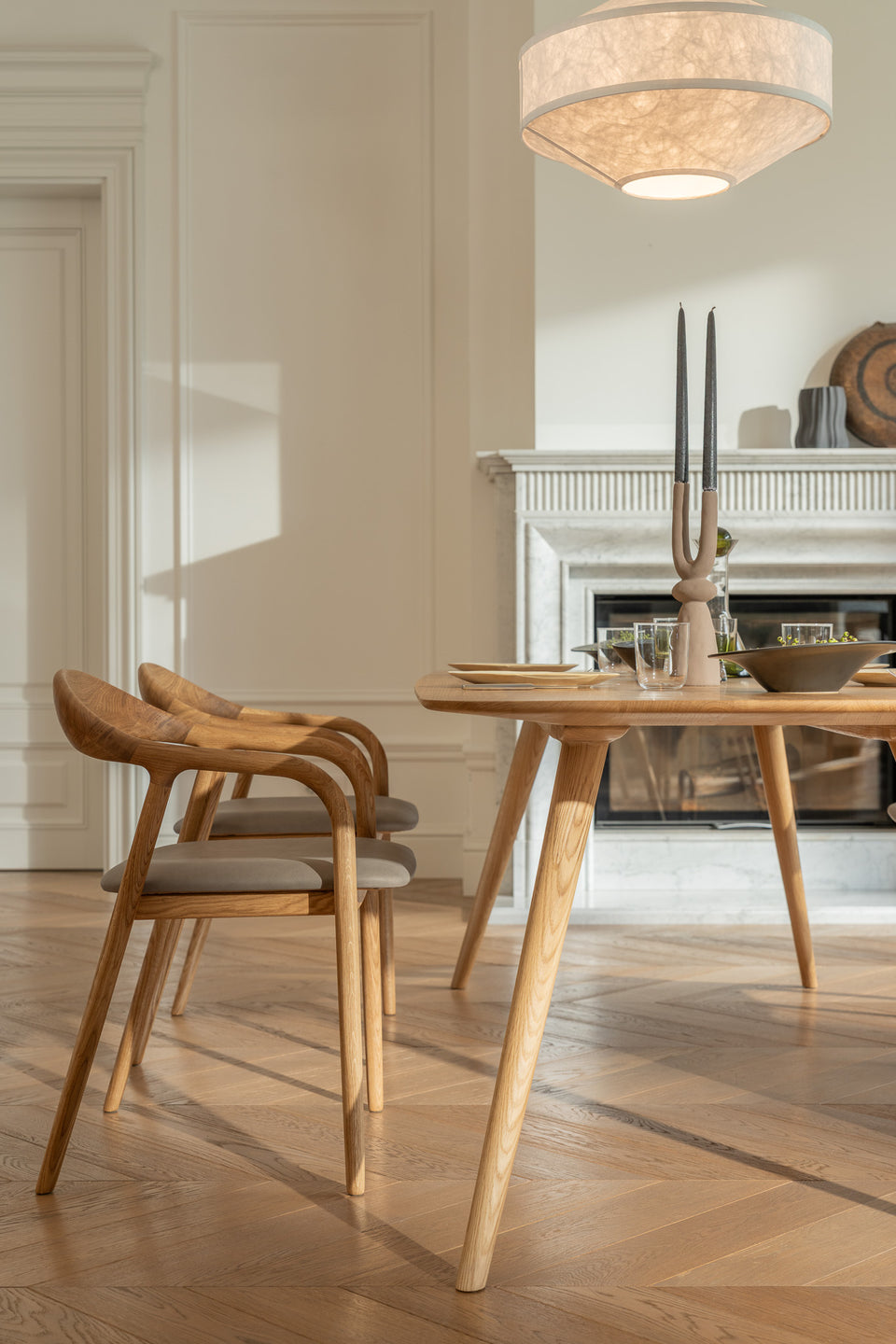 Tapered legs enhance the elegant yet grounded form.